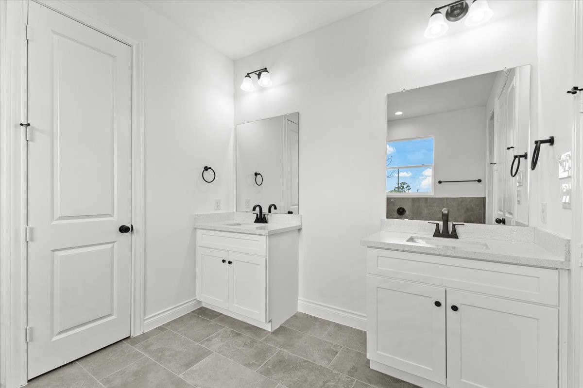 311 Tennessee Street Houston, TX 77029 - Photo 22 of 38 a bathroom with a sink vanity and mirror