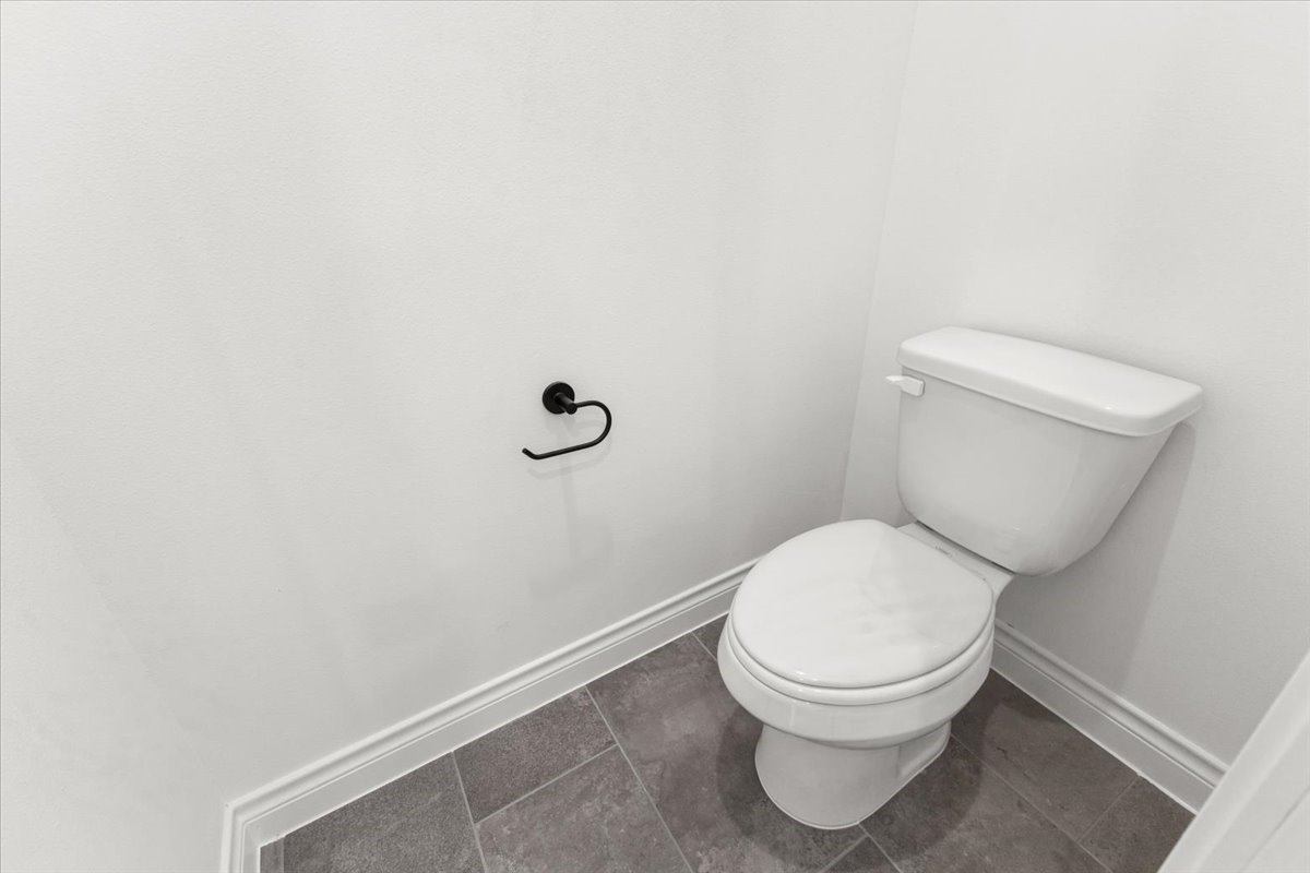 311 Tennessee Street Houston, TX 77029 - Photo 35 of 38 a white toilet sitting next to a white wall