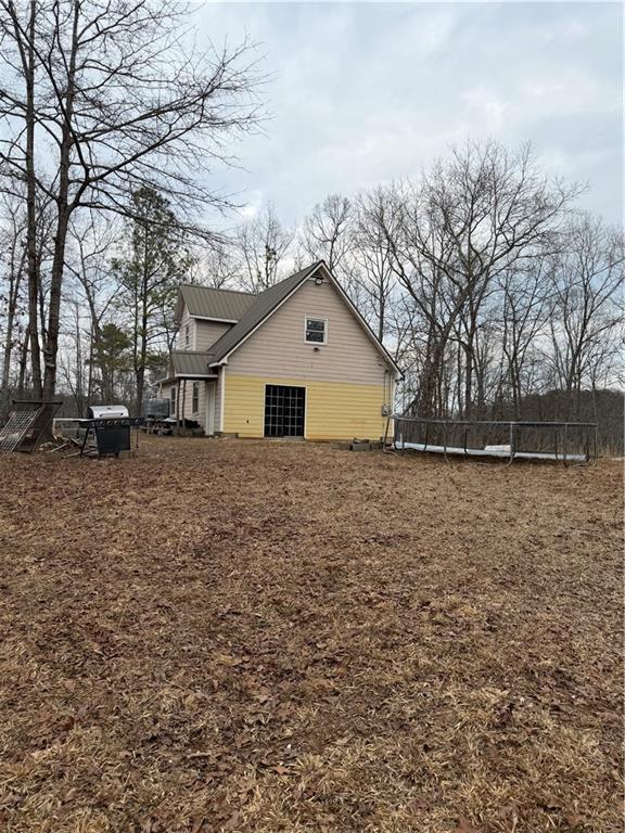 0 Hutcheson Road Temple, GA 30179 - Photo 2 of 9 a white house that has a tree in front of it