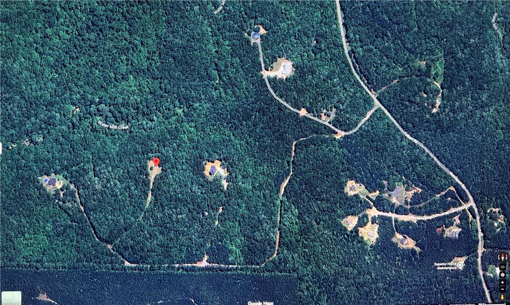 0 Hutcheson Road Temple, GA 30179 - Photo 9 of 9 a backyard of a house with lots of lights and a tree