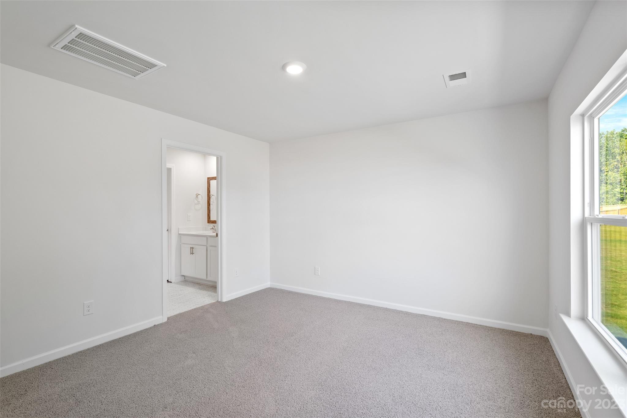 36 Burdock Road Fletcher, NC 28732 - Photo 13 of 18 an empty room with windows and closet