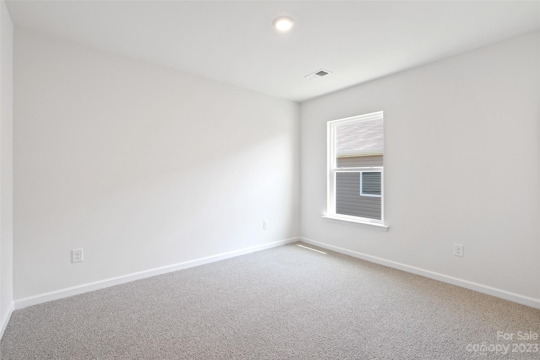 36 Burdock Road Fletcher, NC 28732 - Photo 16 of 18 a view of an empty room with a window