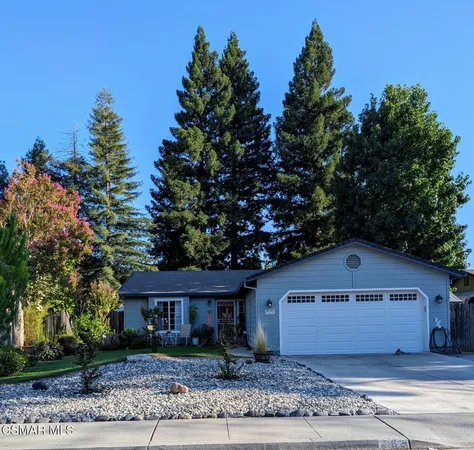 a house with trees in the background