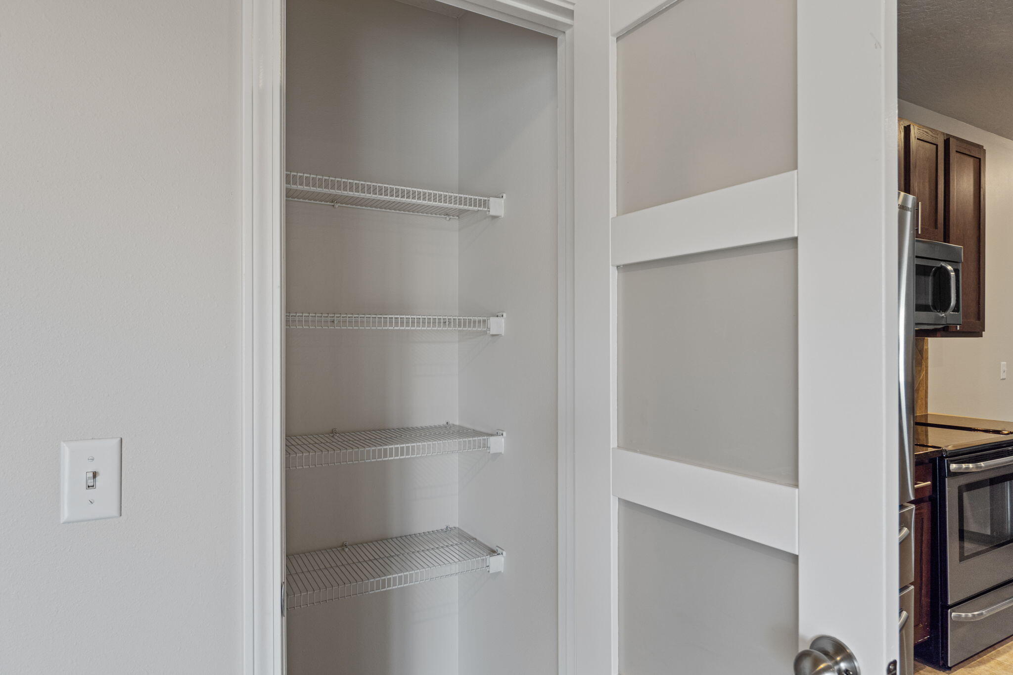 4616 Hermosa Road Crestview, FL 32539 - Photo 14 of 34 Pantry with accent door