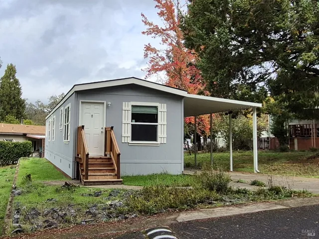 a view of front of house with a yard