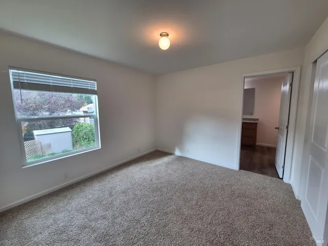 a view of a room with a large window