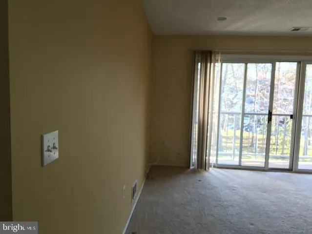 a view of a room with a large window