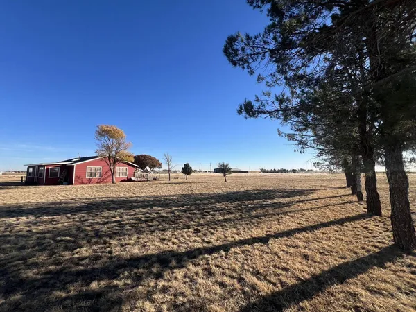 a view of a backyard of a house