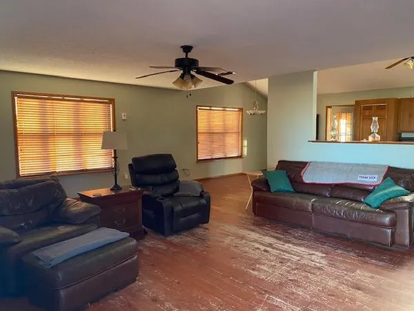 a living room with furniture and a window