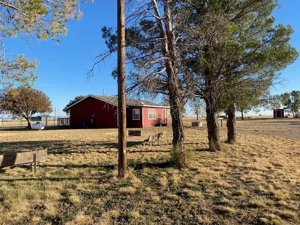 a view of a yard covered with snow