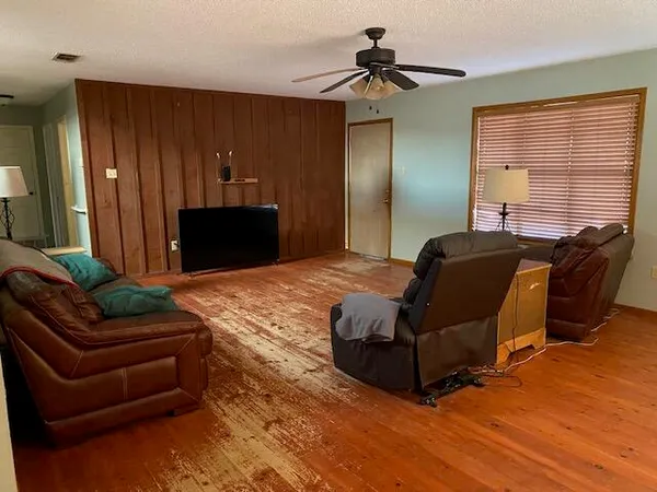 a living room with furniture and a window