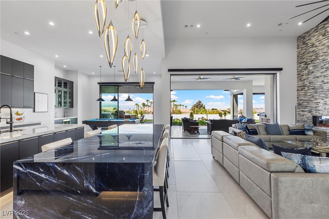 600 Quail Covey Road Henderson, NV 89002 - Photo 23 of 42 Kitchen with modern custom cabinets and high-end appliances