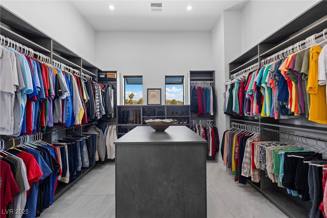 600 Quail Covey Road Henderson, NV 89002 - Photo 29 of 42 Large custom primary bedroom walk-in closet with center custom drawers