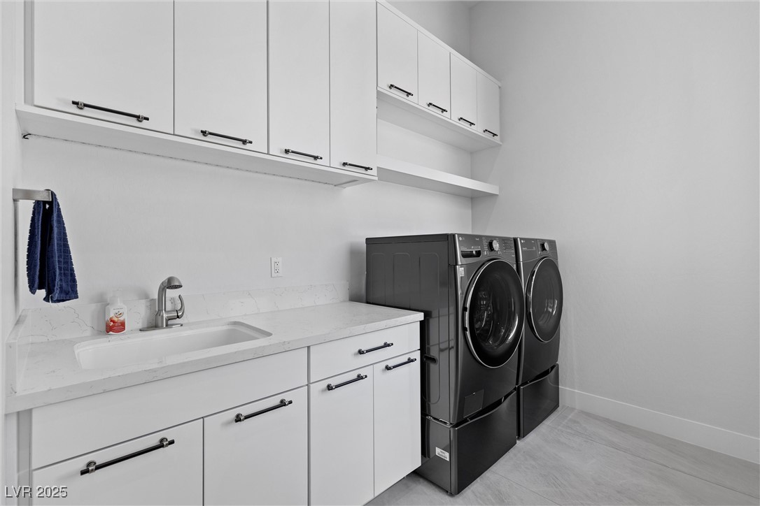 600 Quail Covey Road Henderson, NV 89002 - Photo 36 of 42 Clothes washing area featuring a sink, cabinet space, and independent washer and dryer