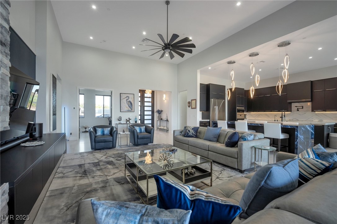 600 Quail Covey Road Henderson, NV 89002 - Photo 2 of 42 Living area featuring recessed lighting, ceiling fan, and a high ceiling