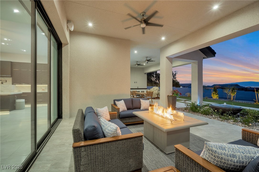 600 Quail Covey Road Henderson, NV 89002 - Photo 6 of 42 View of patio / terrace with area for grilling, an outdoor living space with a fire pit, and a ceiling fan