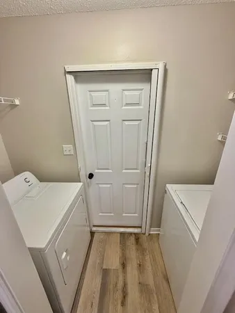 a kitchen with white cabinets and a sink