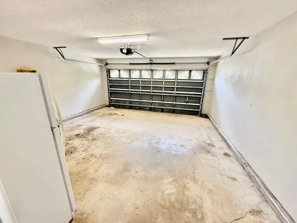 a view of storage and utility room with washer and dryer