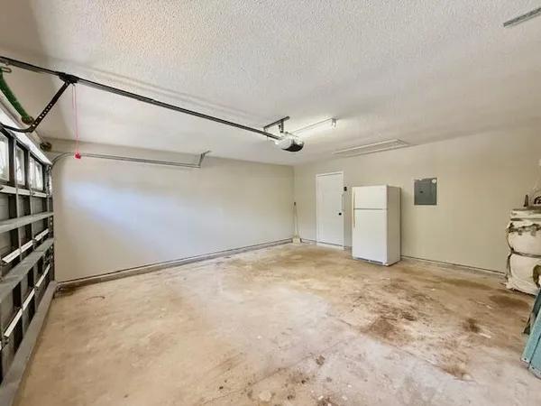 a view of walk in closet with wooden floor