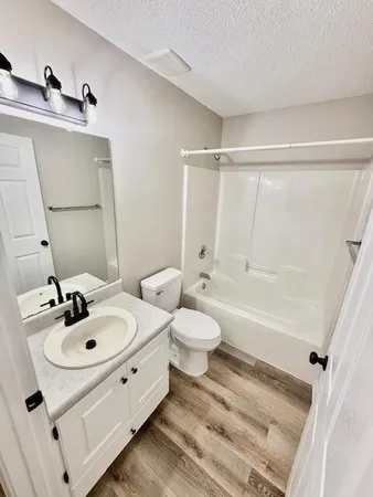 a view of a room with a ceiling fan