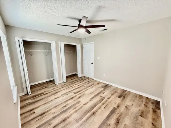 a bathroom with a sink and mirror with toilet