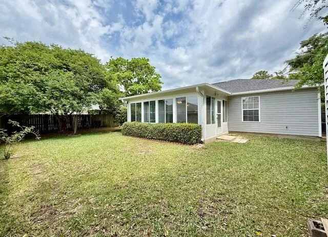 front view of a house with a garden