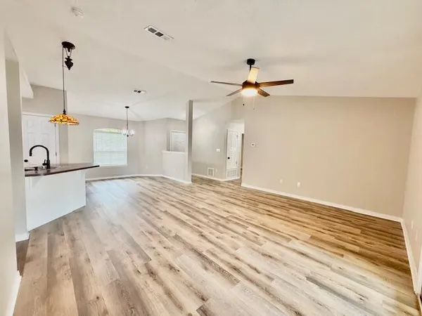 a view of a room with a ceiling fan