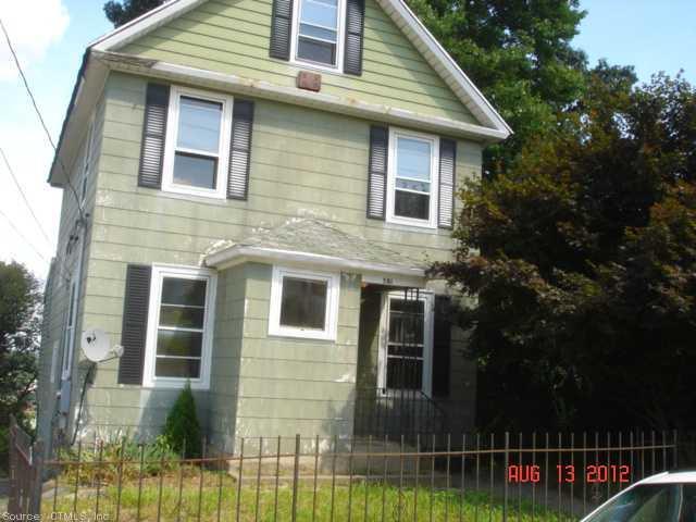 581 Wilson Street Waterbury, CT 06708 - Photo 1 of 1 a front view of a house with a yard