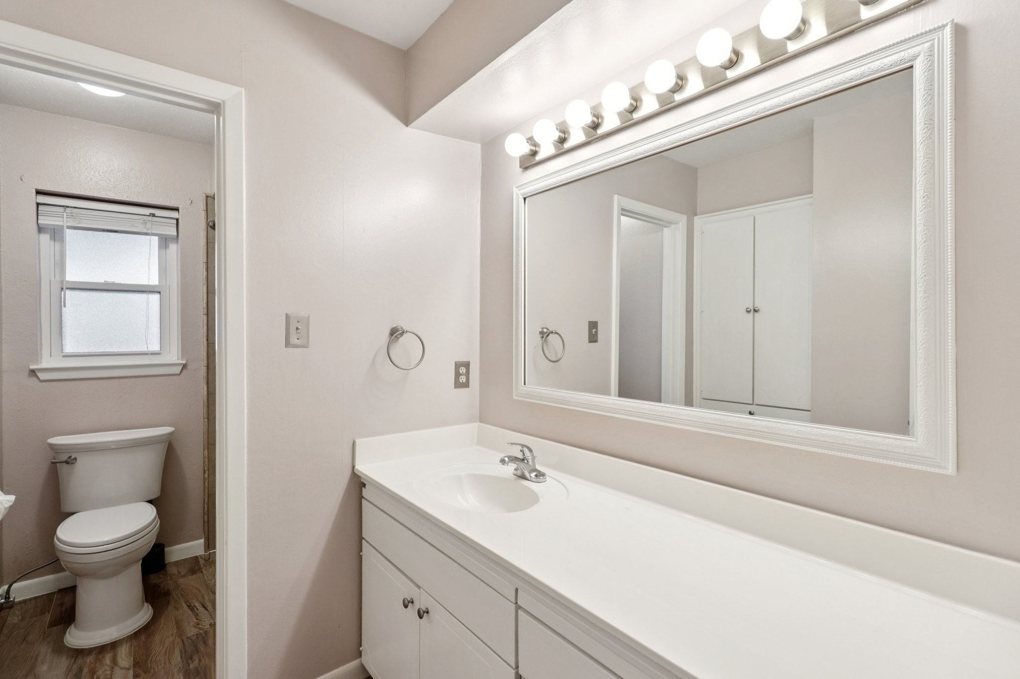 11118 Cedarview Lane Houston, TX 77041 - Photo 12 of 15 a bathroom with a toilet a sink and mirror
