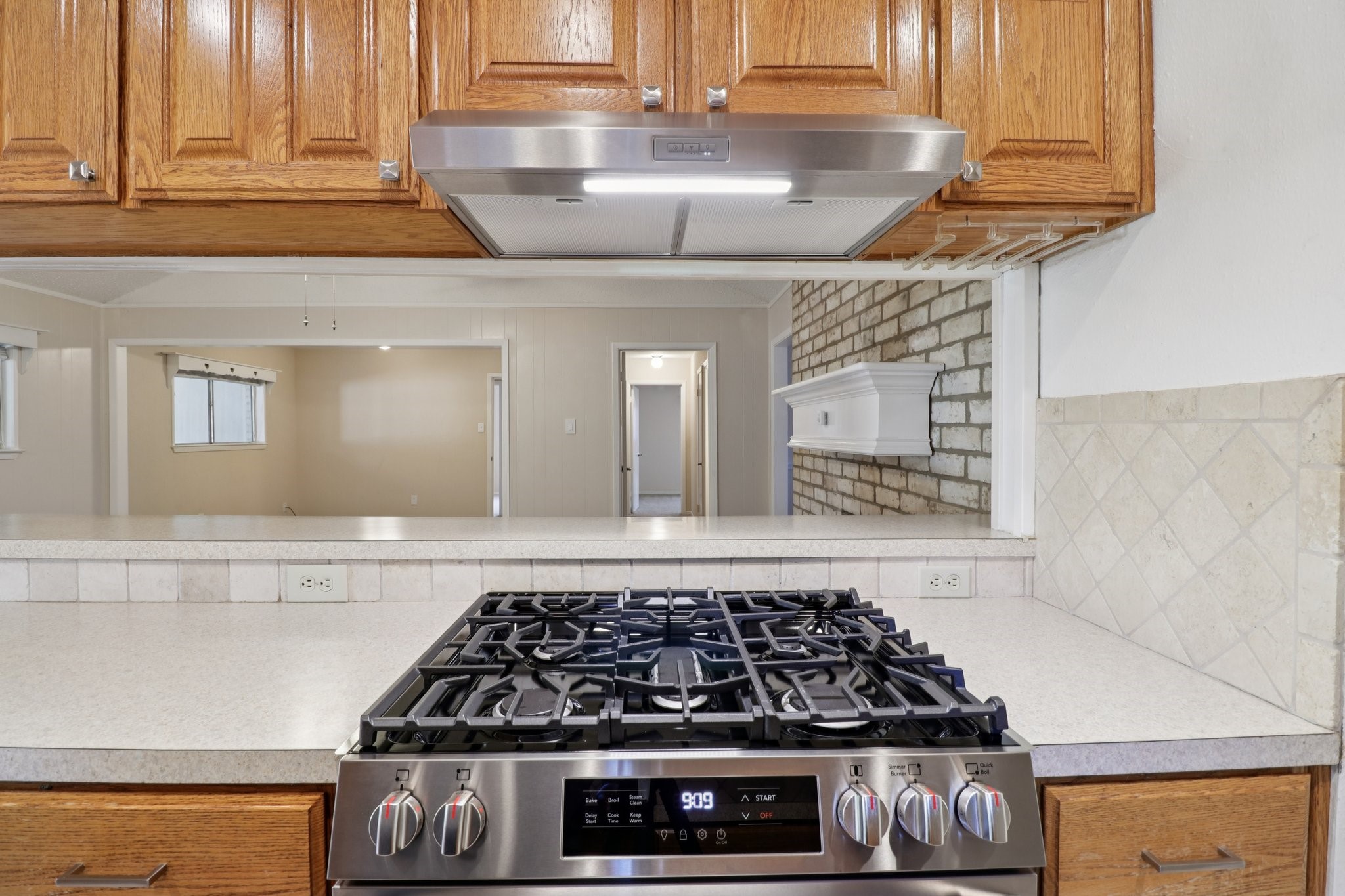 11118 Cedarview Lane Houston, TX 77041 - Photo 5 of 15 a kitchen with a stove and cabinets