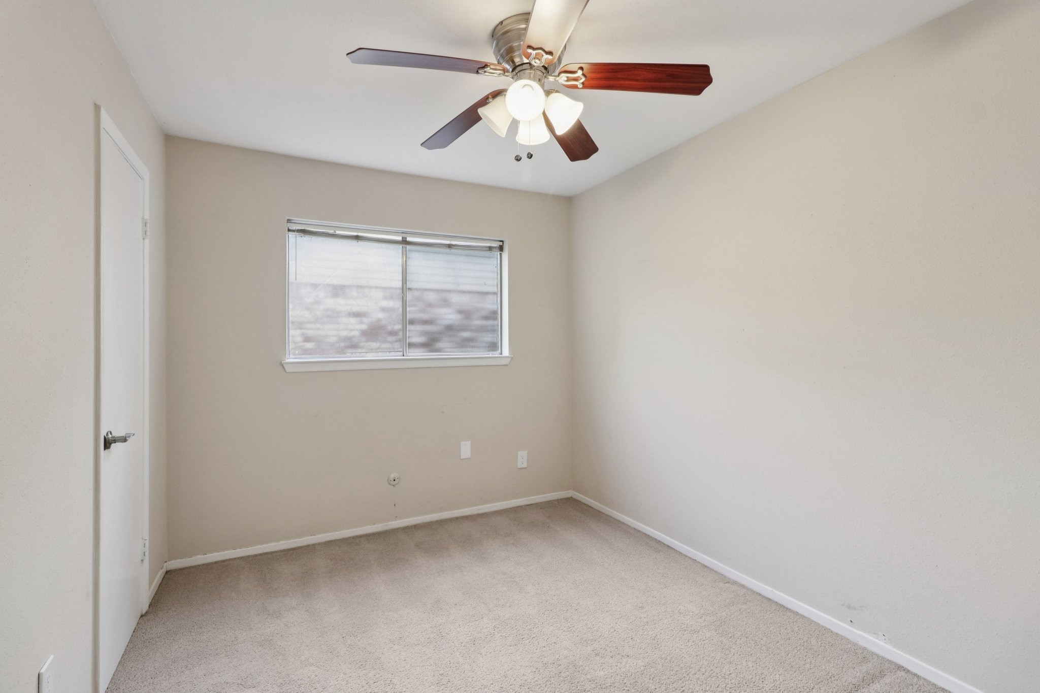 11118 Cedarview Lane Houston, TX 77041 - Photo 10 of 15 an empty room with a window and a fan
