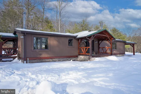a view of a house with a yard and garage