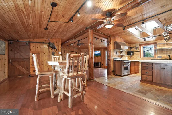 a view of a livingroom with furniture wooden floor and window