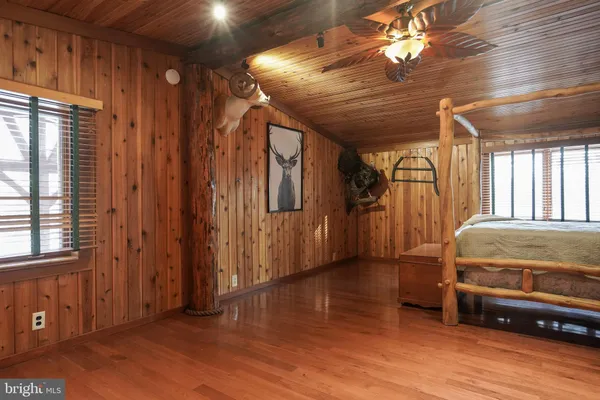 a view of a room with wooden walls