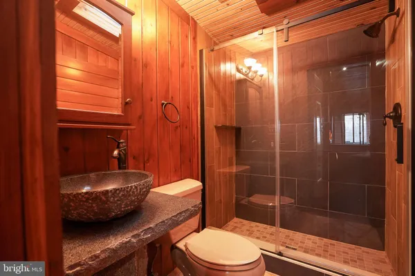 a view of a room with furniture and wooden floor