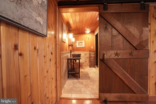 a bathroom with a toilet a sink and a mirror