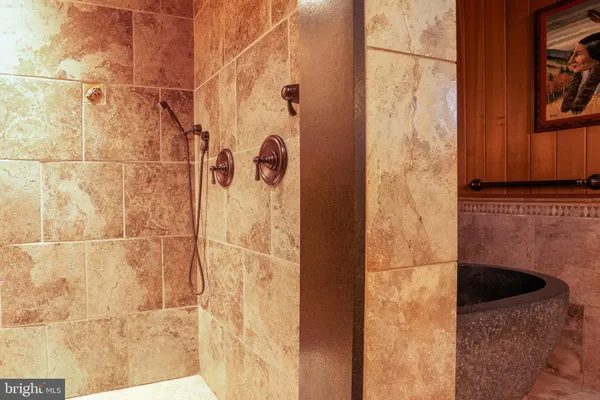 a living room with furniture a ceiling fan