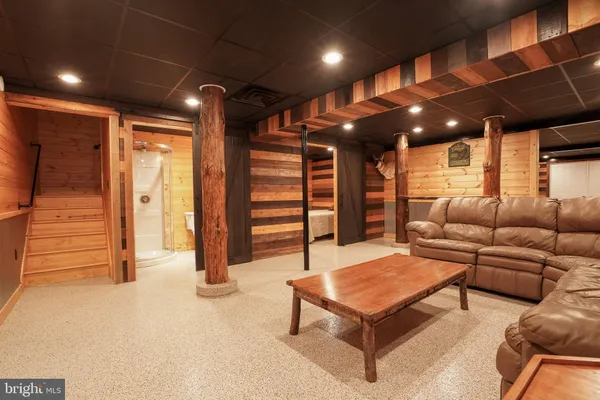 a bedroom with a bed and a large mirror