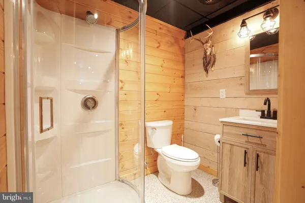 a bedroom with a bed and a view of bathroom