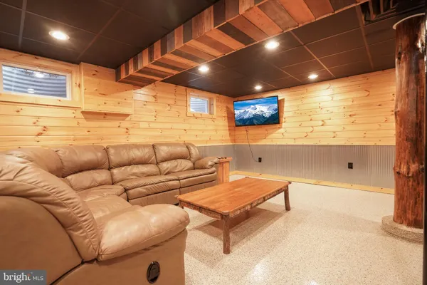 a spacious bedroom with a large window and a walk in closet