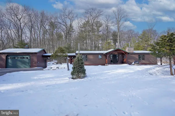 a house with trees in the background
