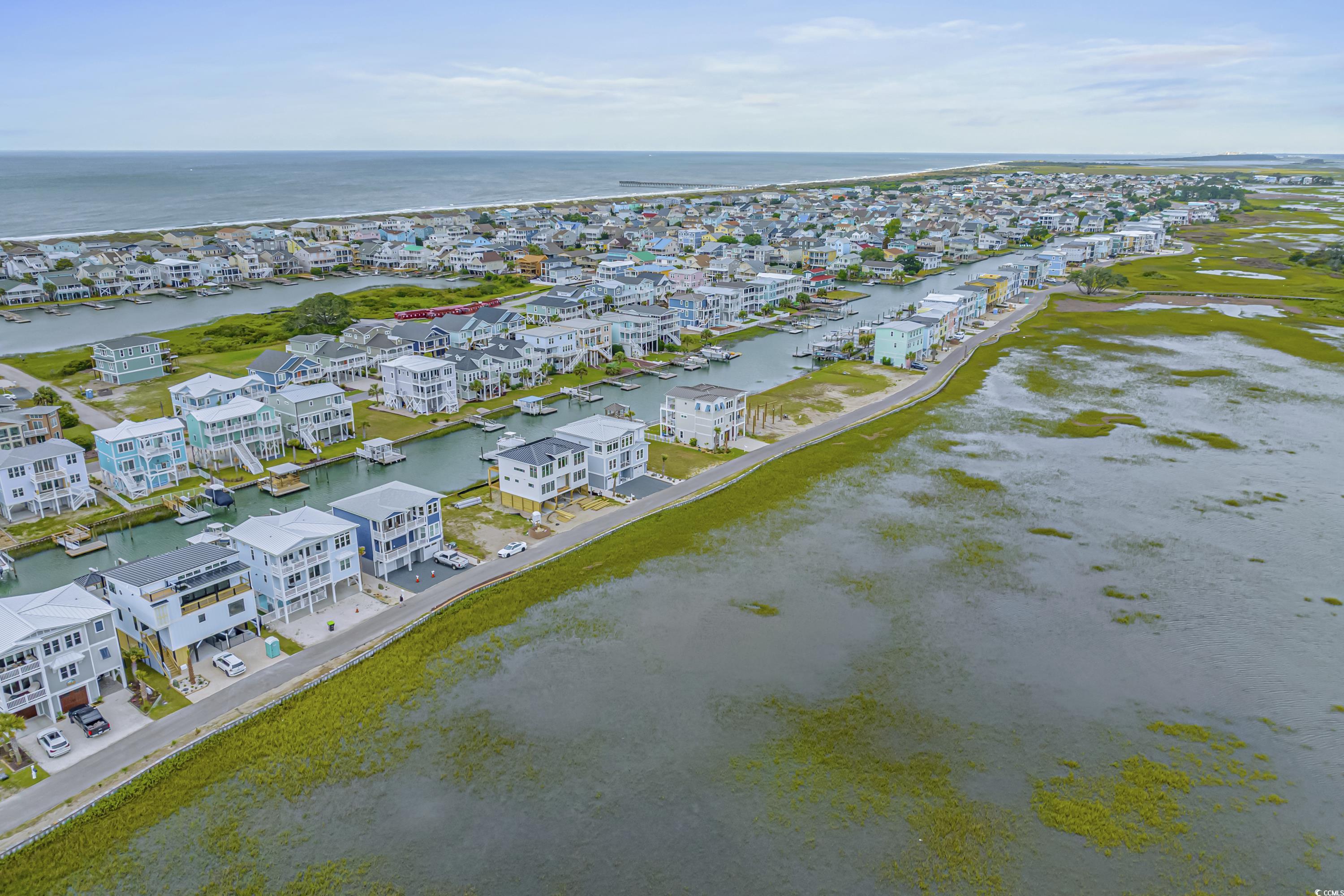 1310 Riverside Drive Sunset Beach, NC 28468 - Photo 4 of 13 Aerial perspective of suburban area featuring a ne