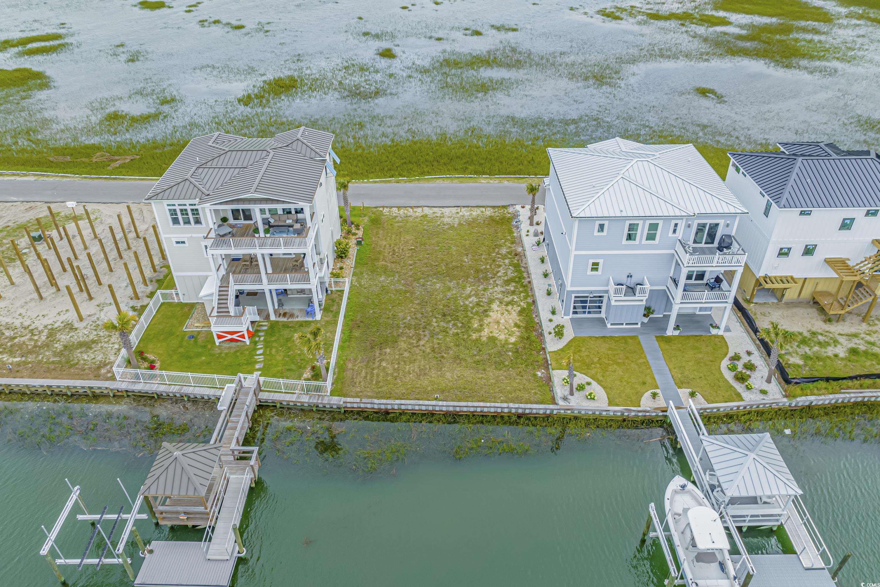 1310 Riverside Drive Sunset Beach, NC 28468 - Photo 8 of 13 Aerial view of property and surrounding area with