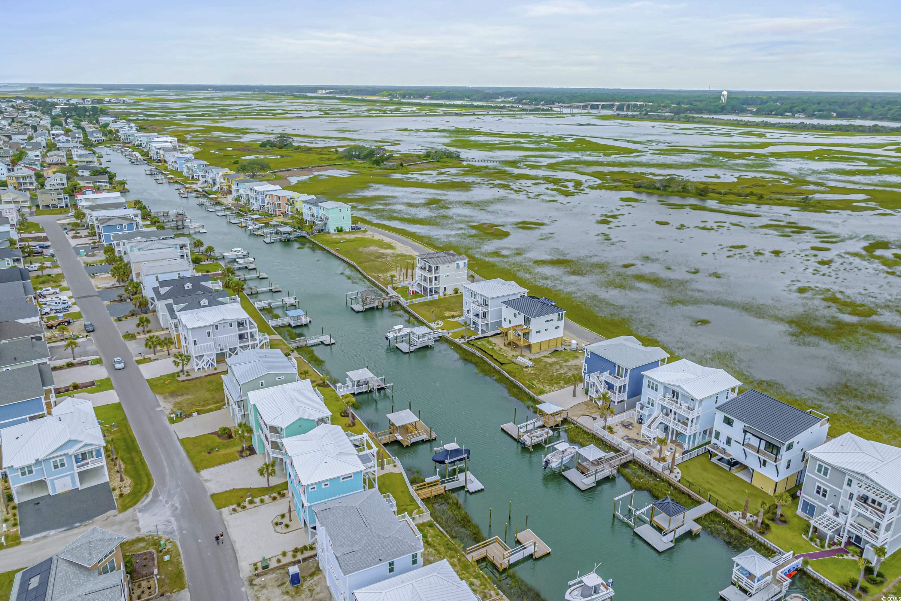1310 Riverside Drive Sunset Beach, NC 28468 - Photo 10 of 13 Aerial view of residential area featuring a nearby