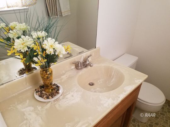 509 Randall Street Ridgecrest, CA 93555 - Photo 11 of 32 a bathroom with a sink a toilet and a mirror
