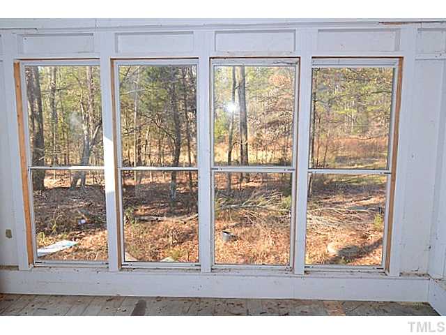590 Gardner Road Apex, NC 27523 - Photo 11 of 12 Pretty Treed View From the Rear Sun Room