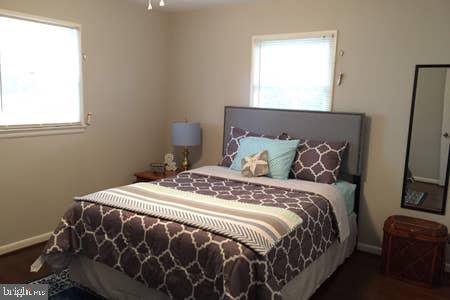 2605 Harrington Road Chester, MD 21619 - Photo 12 of 29 a bed sitting in a bedroom next to a window
