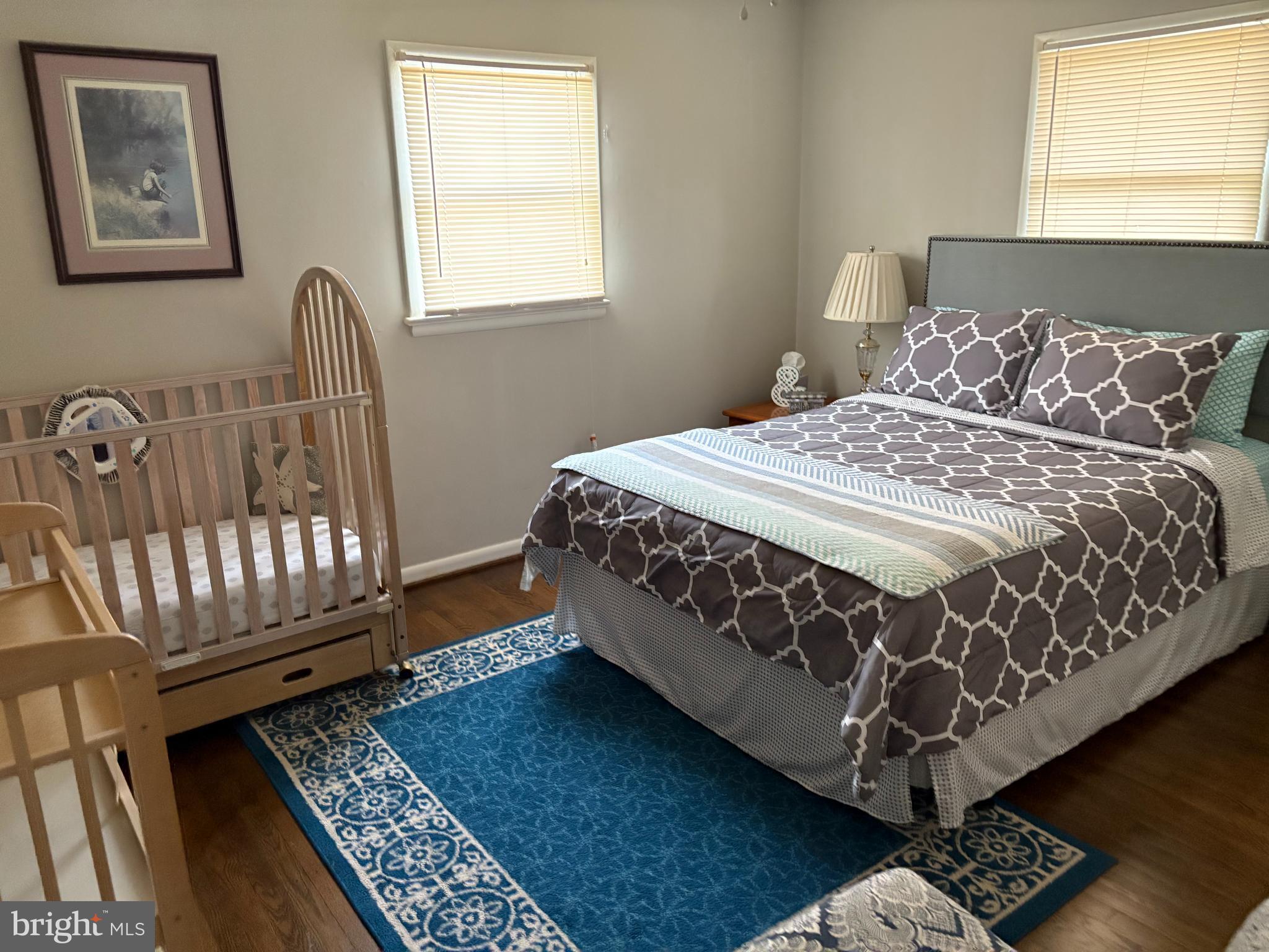 2605 Harrington Road Chester, MD 21619 - Photo 13 of 27 a bed sitting in a bedroom next to a window