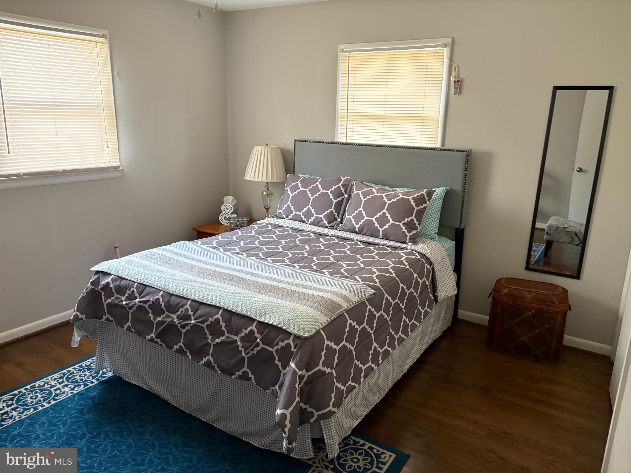 2605 Harrington Road Chester, MD 21619 - Photo 14 of 27 a large bed sitting in a bedroom next to a window