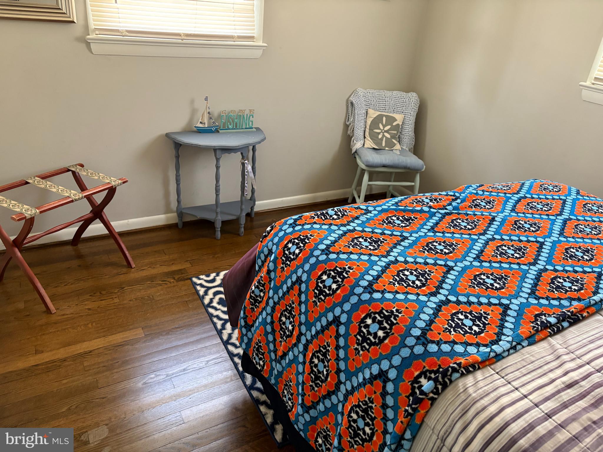 2605 Harrington Road Chester, MD 21619 - Photo 15 of 27 a bedroom with a bed and a potted plant